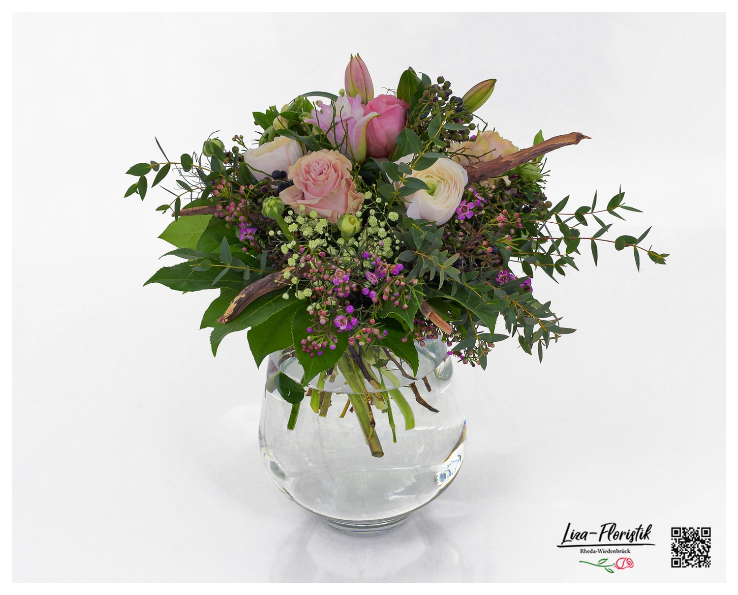 Bouquet with ranunculus, roses, wax flowers, double lilies, gypsophila and ivy