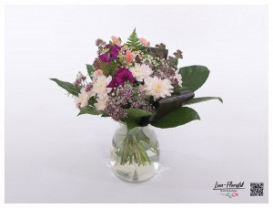Summer bouquet with chrysanthemums, carnations, chamomile, black tie and gypsophila