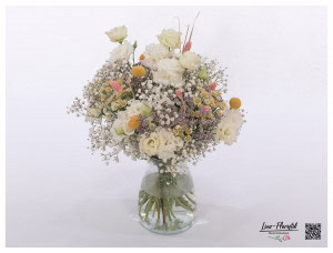 Flower bouquet with lisianthus, chamomile, craspedia and gypsophila