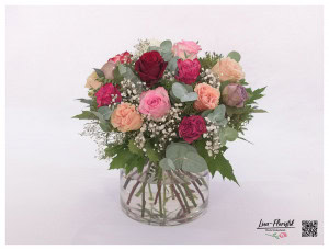 Colorful rose bouquet with gypsophila and eucalyptus