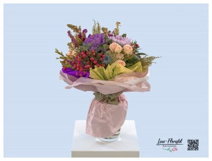 Birthday bouquet with ornamental cabbage, polyantha roses, thistles, snapdragons, rose hips and chrysanthemums