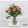 Bouquet with thistles, orange roses, golden gypsophila and eucalyptus