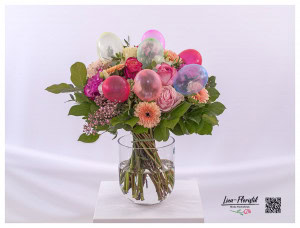 Colorful birthday bouquet with gerberas, roses, lisianthus, golden gypsophila and balloons