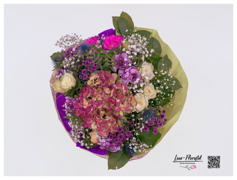 Bouquet with carnations, hydrangea, chrysanthemums, roses, thistle and gypsophila in detail