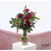 Bouquet with pink chrysanthemums, red roses, lilies, wax flowers and eucalyptus