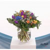 Spring bouquet with hyacinths, colorful tulips, santini, white gypsophila and statize