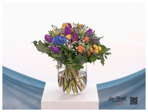 Spring bouquet with hyacinths, colorful tulips, santini, white gypsophila and statize