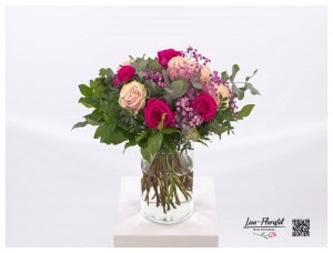 Bouquet with roses in red and salmon colors, eucalyptus, pink gypsophila