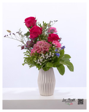 Bouquet with pink roses, pink hydrangea, pink carnations, white gypsophila, statice and astrantia