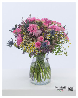 Bouquet with pink gerberas, pink roses, thistles, sea lavender and chamomile