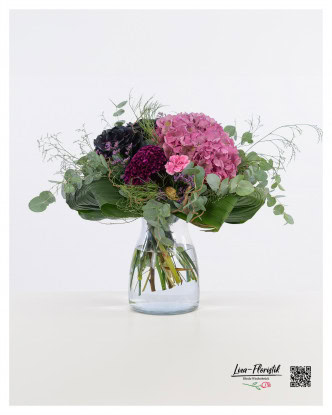 This elegant bouquet combines the dramatic beauty of black roses with the vibrant color of a pink hydrangea, complemented by the delicate green of eucalyptus, the velvety texture of celosia, the delicate accents of sea lavender and the playful flowers of carnations.