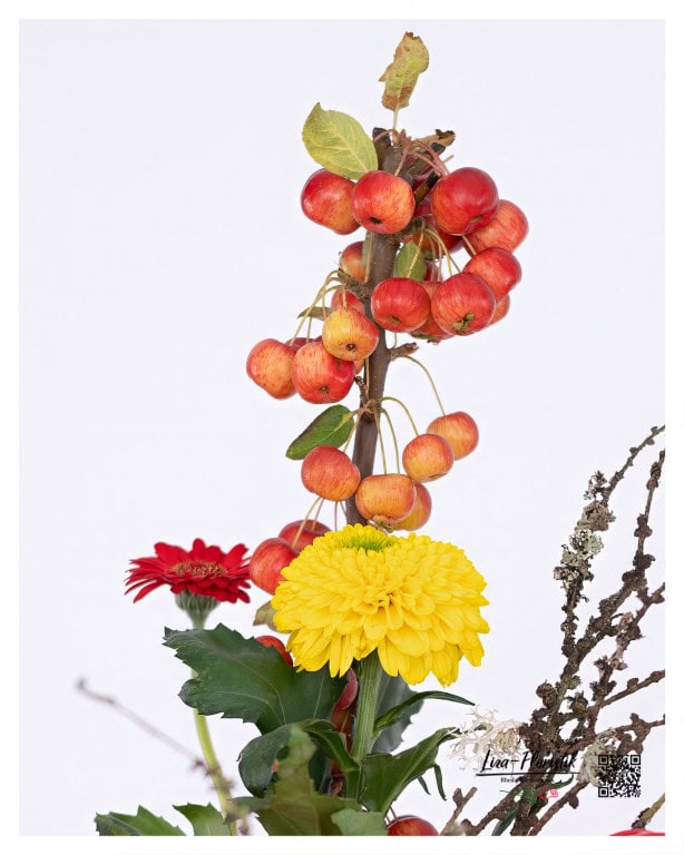 Detailed shot of the birthday bouquet with apple branches, chrysanthemums and larch branches