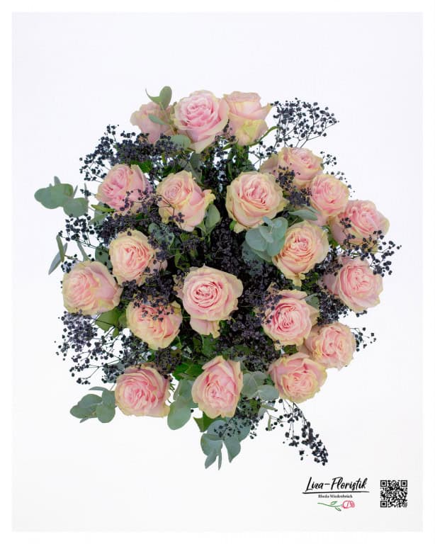 From a bird's eye view, the bouquet appears as a dense, harmonious arrangement in which the delicate pink roses are surrounded by dark gypsophila, while the eucalyptus leaves form a subtle green frame.