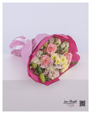 Magical birthday bouquet with delicate chrysanthemums, elegant roses, noble lilies and playful lisianthus - perfect for special occasions