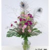 Bouquet with peacock eyes, carnations, lisianthus and statice