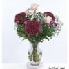 Deep red hydrangeas, delicate roses, chrysanthemums, gypsophila and fresh eucalyptus come together in this bouquet to create a harmonious composition that radiates natural elegance.