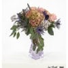 Elegant bouquet with thistles and pastel roses, and hydrangeas combined with gypsophila and eucalyptus - an elegant choice for special occasions.