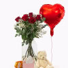 A sign of affection: 10 deep red premium roses, a cuddly soft teddy bear, sweet Ferrero kisses, a heart balloon and your personal message - everything to give a special person a smile.