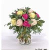 Rose composition in soft pastel tones and strong pink. This rose bouquet combines delicate cream and pink tones with bright pink, accented by fresh eucalyptus and greenery. A stylish arrangement in a glass vase that will brighten up any room.