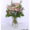 A lovingly arranged bouquet of roses, chrysanthemums, lisianthus, eucalyptus and gypsophila - harmonious colors and shapes for special moments.