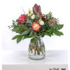 Winter Greetings: Bouquet with amaryllis, roses, lisianthus, eucalyptus, pistachio and festive colored cinnamon - perfect for special occasions.