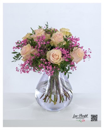 Delicate romance - A lovingly tied bouquet of pink roses, framed by delicate pink gypsophila and subtle green for a romantic touch.