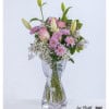 An elegant birthday bouquet with pink roses, chrysanthemums and lilies - a loving gesture that brings joy.
