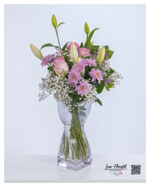 An elegant birthday bouquet with pink roses, chrysanthemums and lilies - a loving gesture that brings joy.