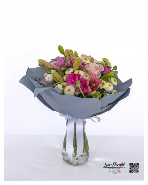 Bouquet in pink, hot pink and white with roses, alstromerias, closed lilies, butterflies and white santini - freshly tied in a harmonious color composition.