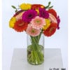 Colorful bouquet with Gerbera in strong colors such as pink, orange, yellow and delicate pink, lovingly tied in a round shape and complemented with green.