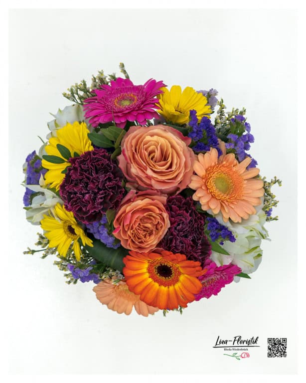 Small bouquet of flowers with roses, gerberas, carnations, statice and alstroemerias - tied in a round shape, colorfully and detailedly arranged for loving greetings or small gifts.