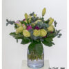 Exclusive bouquet of flowers with light green Ecuador roses, pink double lilies, bearded carnations in strong purple and fresh eucalyptus - tied round with elegant, dark green foliage.