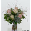 Luxuriant bouquet with pink roses, cream-colored hydrangea, delicate ornamental grass, white gypsophila and green privet berries