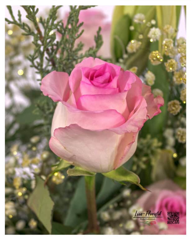 Expressive flower bouquet with pink roses, protea and amaryllis in warm autumn atmosphere