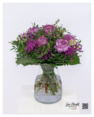 Romantic bouquet with purple roses, carnations, baby's breath and chamomile in various violet tones