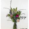 An Easter bouquet featuring parrot tulips combines wild beauty with Easter joy. Parrot tulips, carnations, cherry branches, and ranunculus are arranged harmoniously.