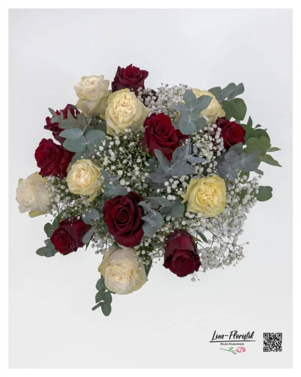 In detail: red and white Ecuador roses, white baby's breath and eucalyptus
