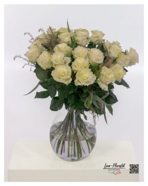 Lush bouquet of cream-white premium roses with golden accent elements, generously arranged and radiating an elegant, harmonious presence.