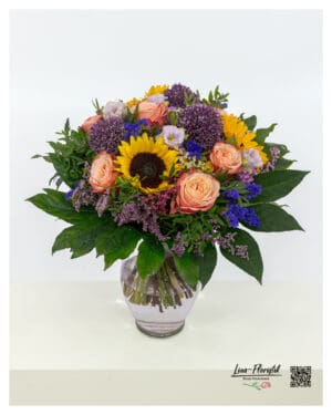 Colorful summer bouquet with sunflowers and roses
