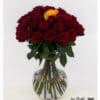 Dark red roses with a single yellow rose in the center