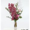 A flower bouquet with orchids, premium roses and olive branches.