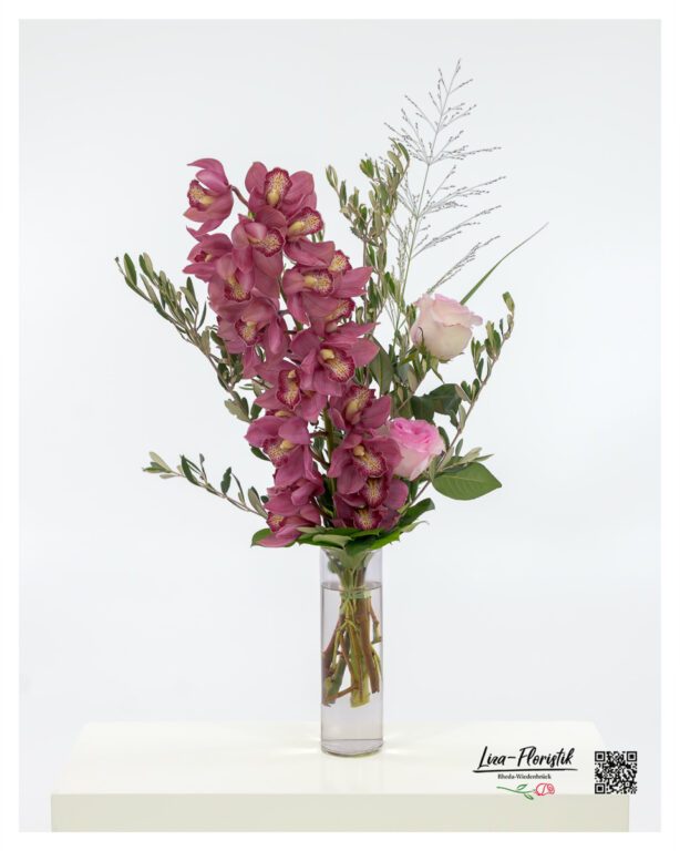 A flower bouquet with orchids, premium roses and olive branches.